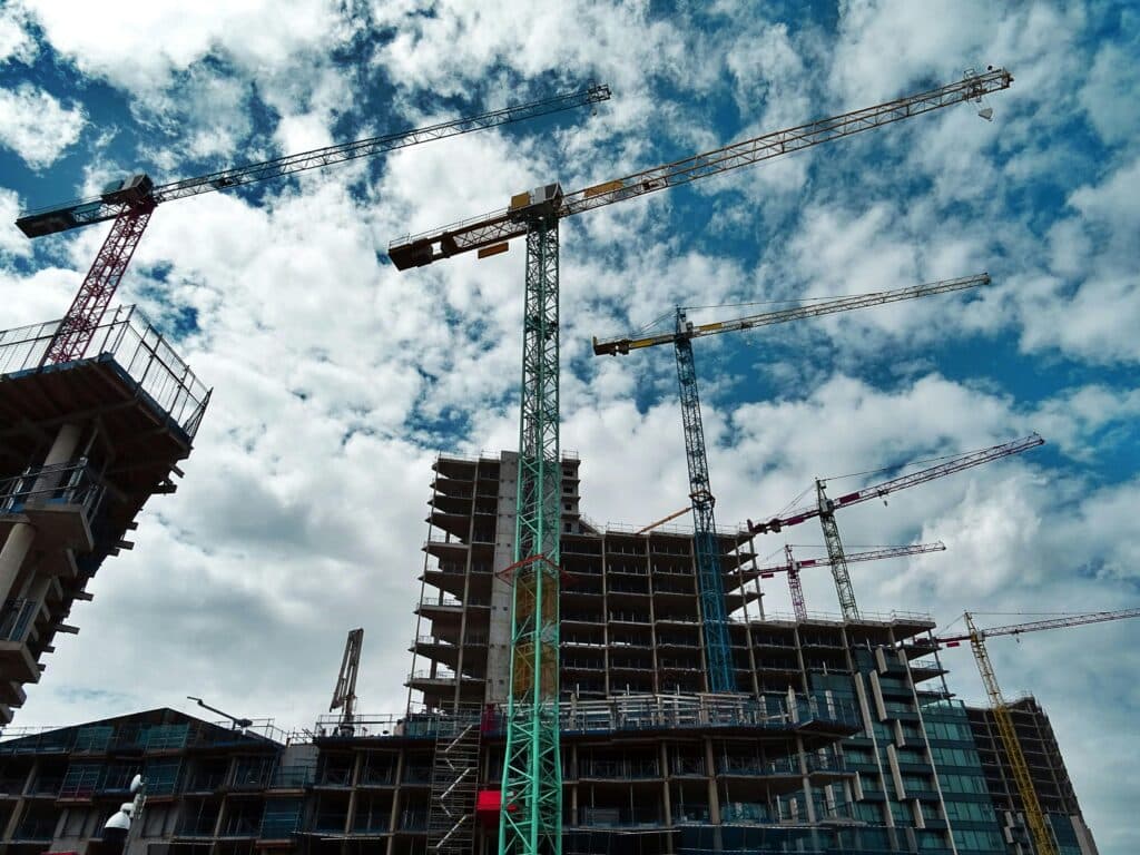 High Rise Building Under Construction with Cranes